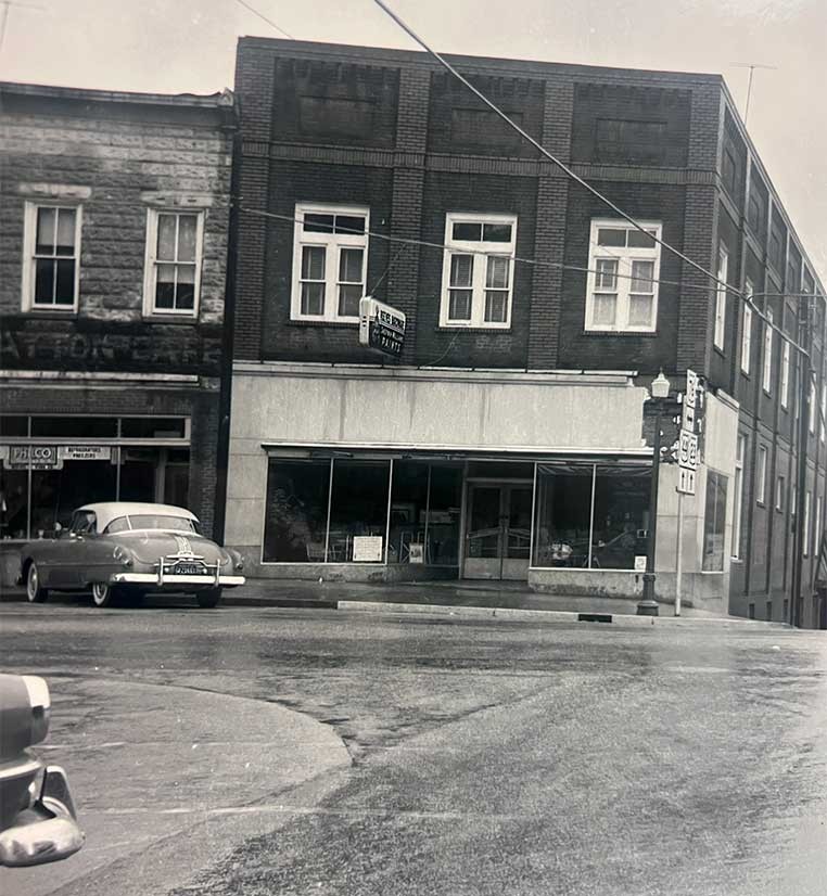 Black and white photo of an old brick building